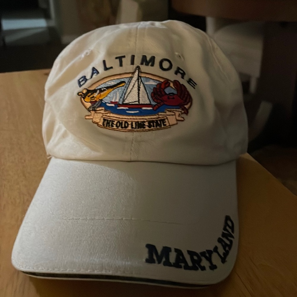 Baltimore Maryland cap beige in color. The emblem state “The Old Line State”